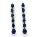 Rhodium Plated Silver Toned Teardrop Shaped Navy Blue American Diamond Studded Linear Dangler Earrings