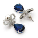 Rhodium Plated Silver Toned Bow Shaped Navy Blue & White American Diamond Studded Drop Earrings