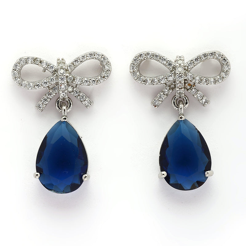 Rhodium Plated Silver Toned Bow Shaped Navy Blue & White American Diamond Studded Drop Earrings