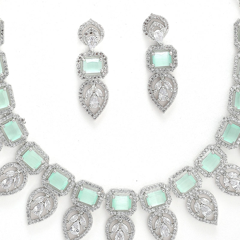 Rhodium Plated Silver Toned Teardrop Floral Design White  & Sea Green Square AD Studded Necklace Set & Matching Earrings