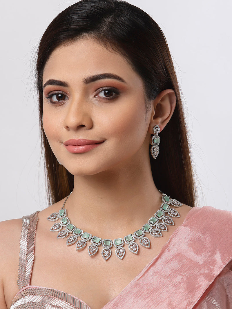 Rhodium Plated Silver Toned Teardrop Floral Design White  & Sea Green Square AD Studded Necklace Set & Matching Earrings