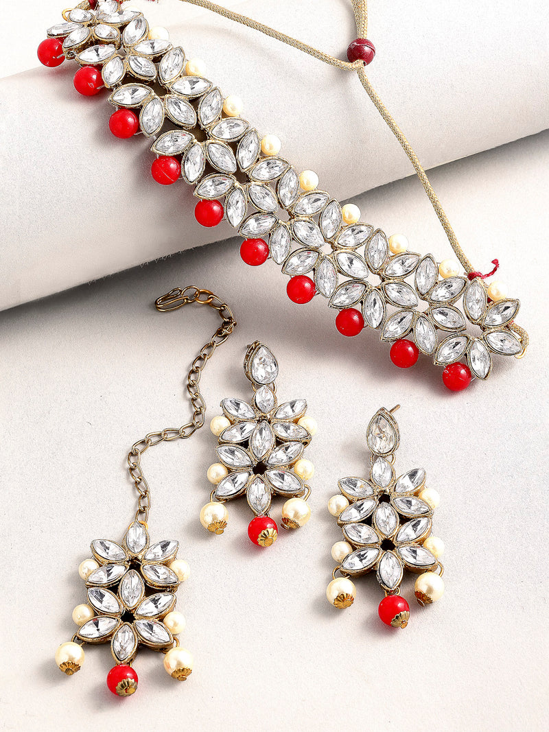 Gold Plated Royal Crafted Stones Studded And Red And Pearl Beads Flower Shaped Necklace Set With  Maang Tikka And Earrings