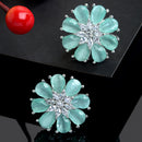 Sea Green American Diamond Studded Floral Shaped Rhodium-Plated with Silver-Tone Studs Earrings