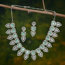 Rhodium Plated Silver Toned Teardrop Floral Design White  & Sea Green Square AD Studded Necklace Set & Matching Earrings