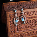 Rose Gold-Plated Gunmetal Toned Blue American Diamond studded Quirky Shaped Drop Earrings