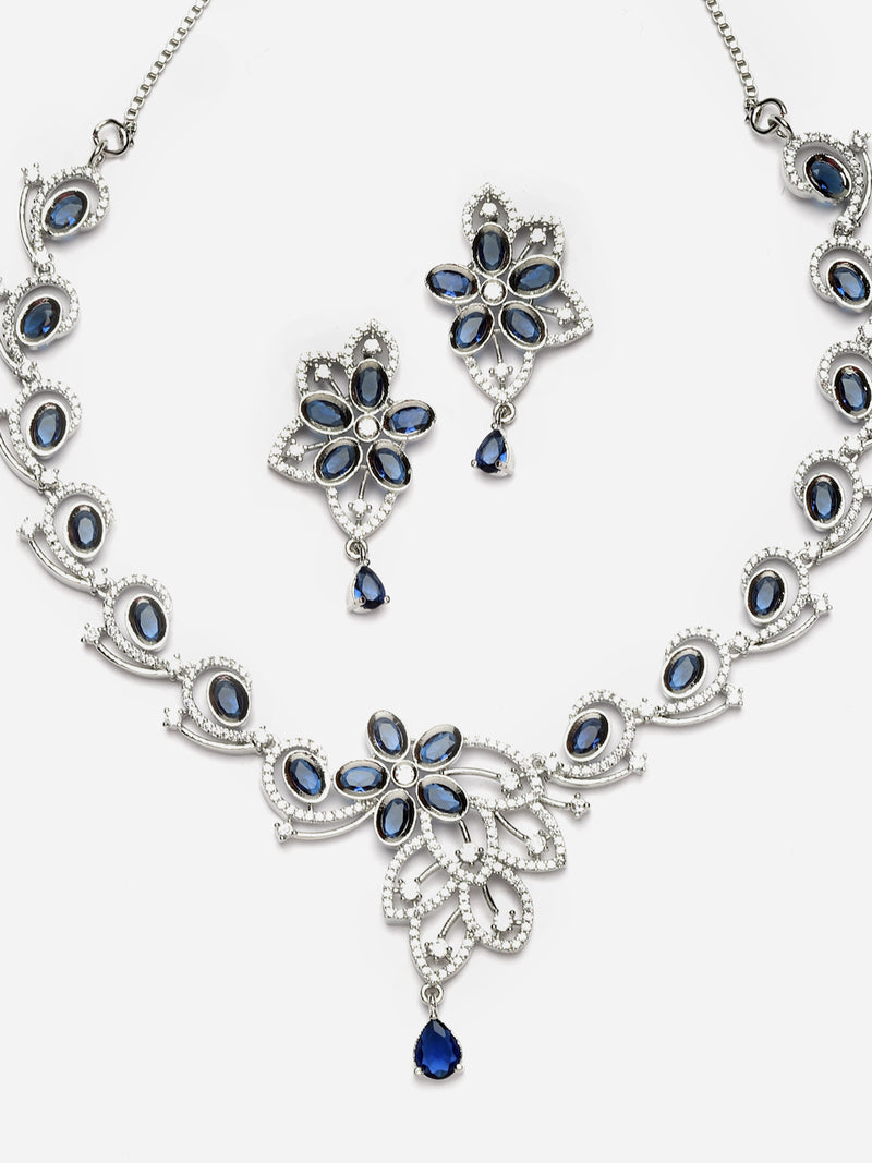 Rhodium-Plated Navy Blue American Diamond Studded Floral & Paisley Shaped Necklace with Earrings Jewellery Set