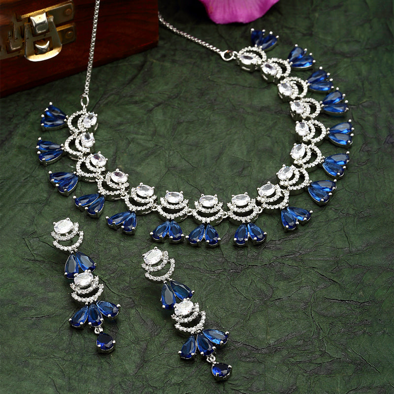 Rhodium-Plated Navy Blue American Diamond Studded Teardrop & Crescent Shaped Necklace with Earrings Jewellery Set