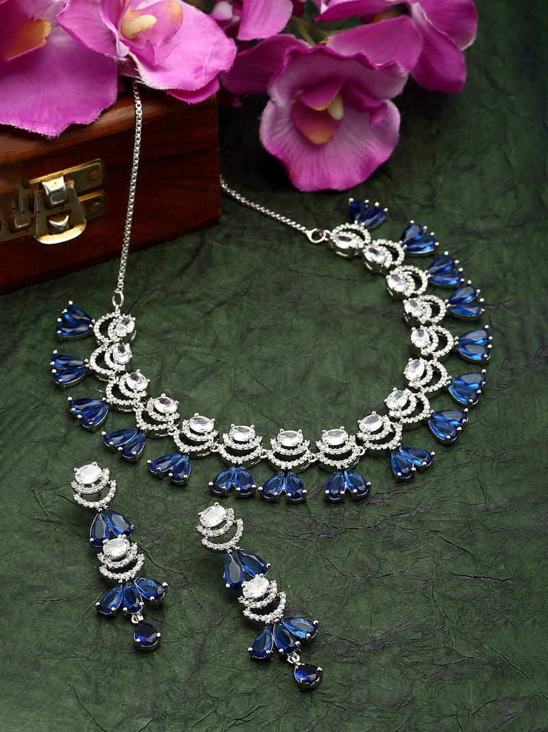 Rhodium-Plated Navy Blue American Diamond Studded Teardrop & Crescent Shaped Necklace with Earrings Jewellery Set