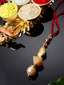 Gold-Plated Stone & White Pearl Studded Lumba Rakhi For Bhabhi