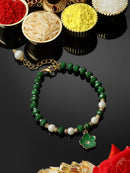 Gold Plated Gold Toned Green Floral Charm Studded Rakhi Bracelet
