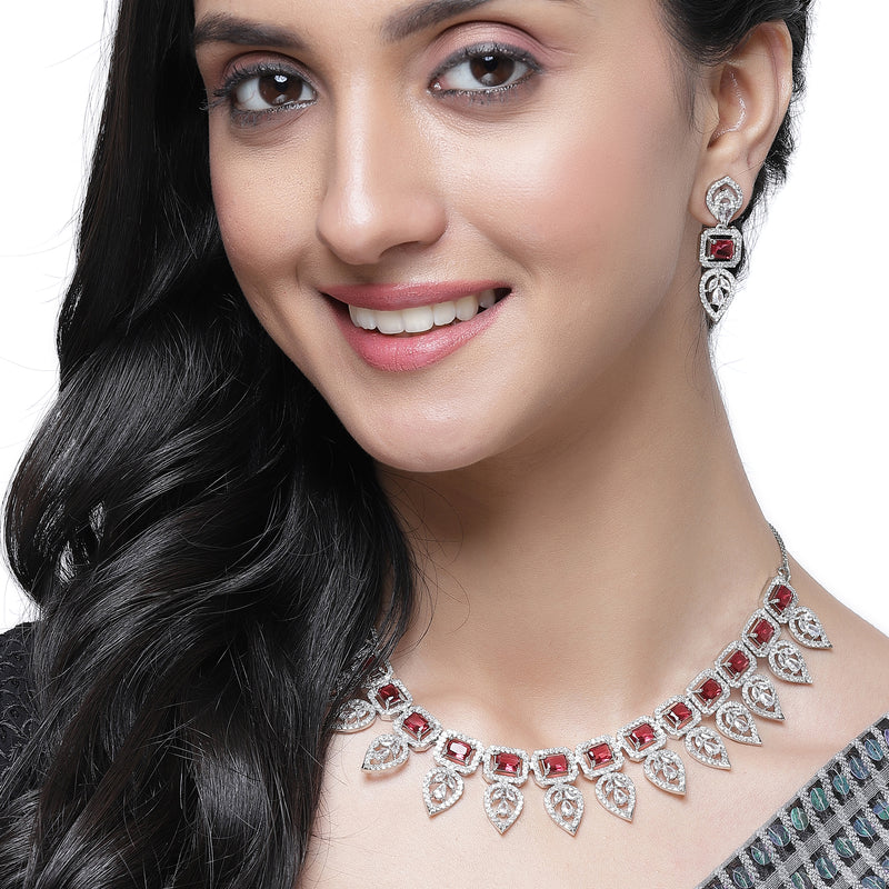 Rhodium-Plated Red American Diamond Studded Leaf Shaped Necklace with Earrings Jewellery Set