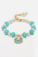 Gold Plated Gold Toned Sky Blue & White Shell Charm Studded Rakhi Bracelet