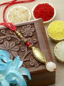 Traditional Classy Gold-Plated White Beads Studded Lumba Rakhi For Bhabhi