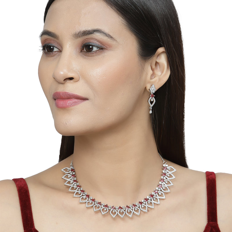 Rhodium-Plated Red American Diamond Studded Floral & Leaf Shaped Necklace with Earrings Jewellery Set