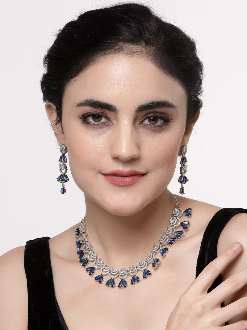 Rhodium-Plated Navy Blue American Diamond Studded Teardrop & Crescent Shaped Necklace with Earrings Jewellery Set