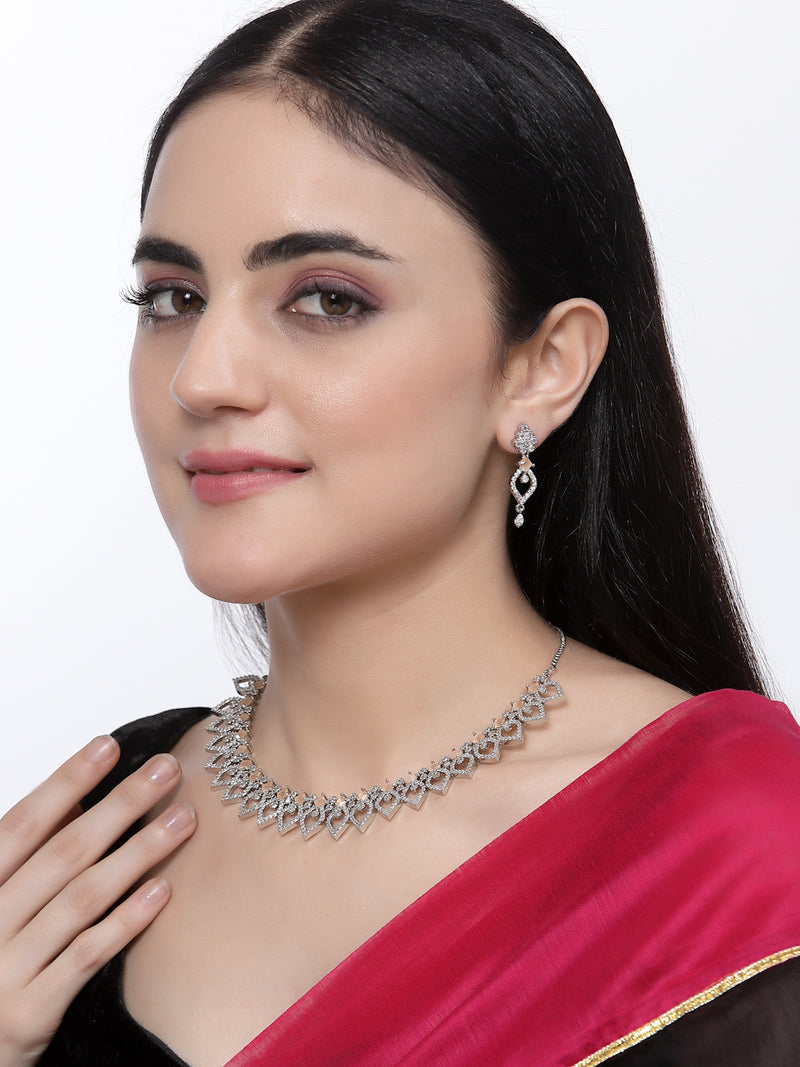 Rhodium-Plated Orange American Diamond Studded Floral & Leaf Shaped Necklace with Earrings Jewellery Set