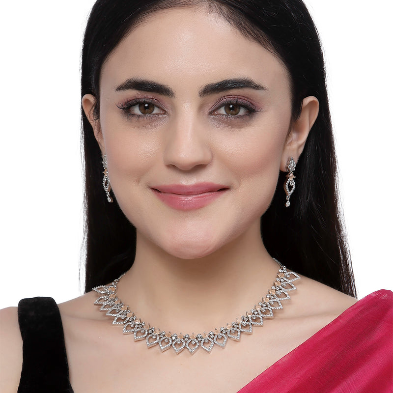 Rhodium-Plated Orange American Diamond Studded Floral & Leaf Shaped Necklace with Earrings Jewellery Set
