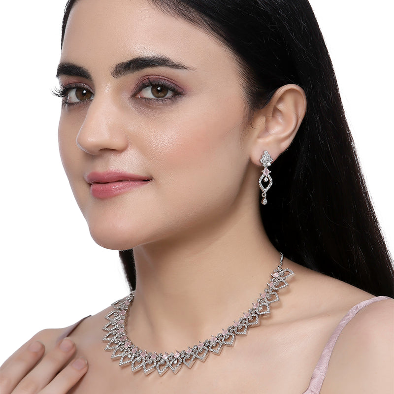 Rhodium-Plated Pink American Diamond Studded Floral & Leaf Shaped Necklace with Earrings Jewellery Set
