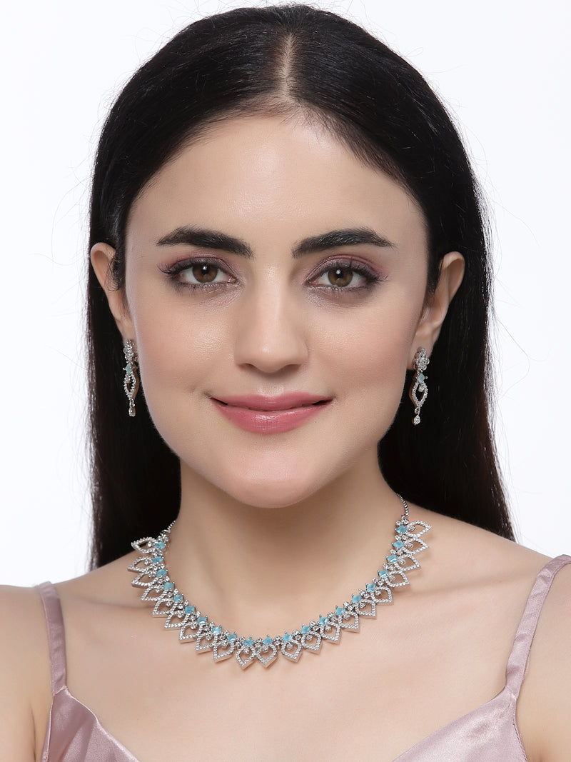 Rhodium-Plated Blue American Diamond Studded Floral & Leaf Shaped Necklace with Earrings Jewellery Set