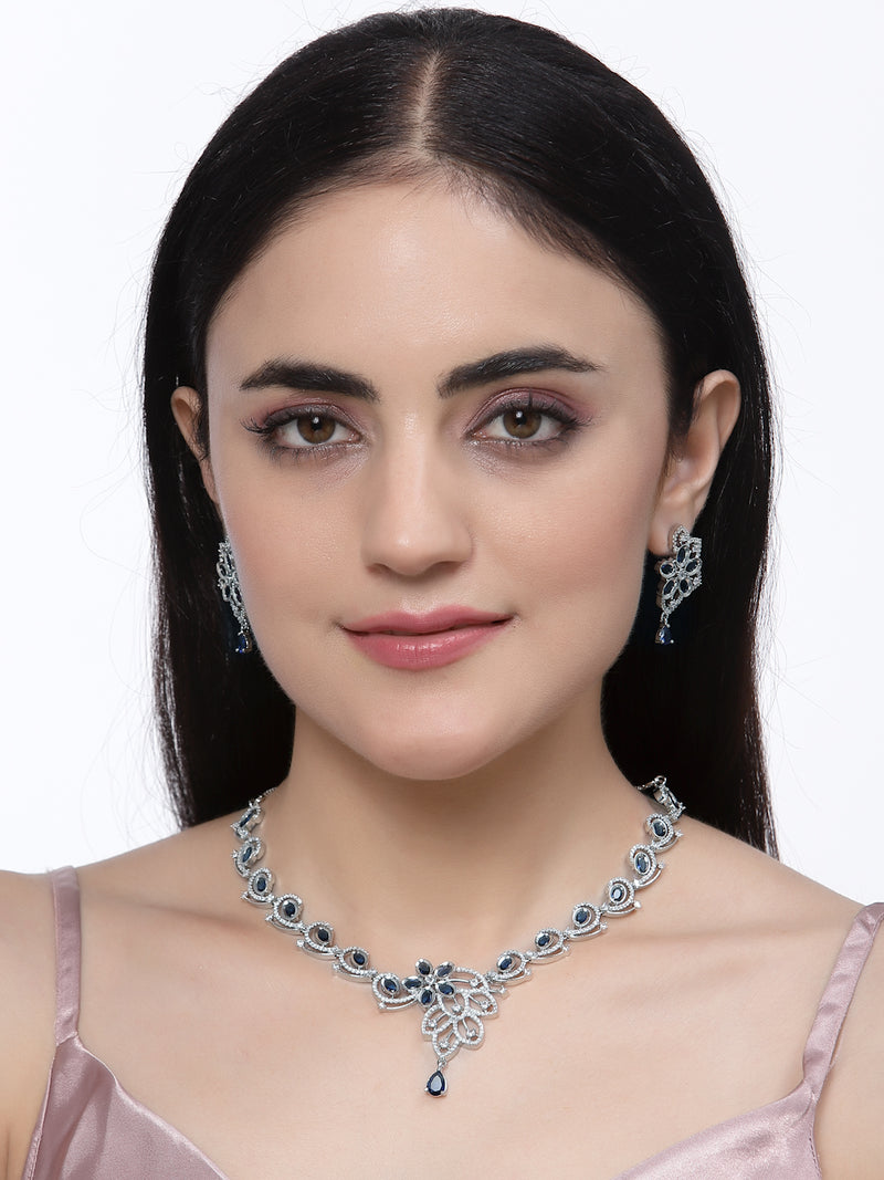 Rhodium-Plated Navy Blue American Diamond Studded Floral & Paisley Shaped Necklace with Earrings Jewellery Set