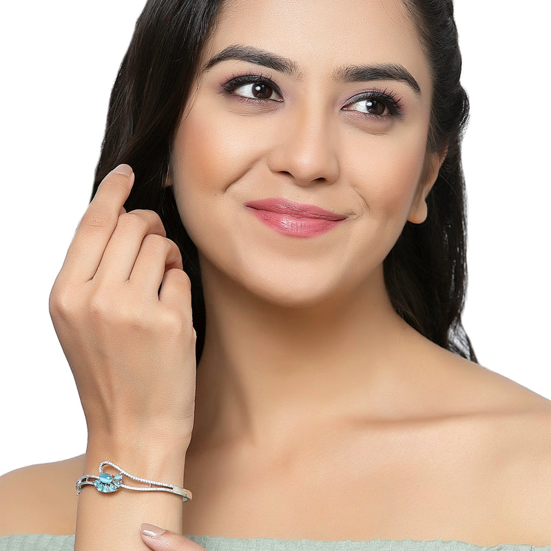 Rhodium Plated Silver Toned Flower Shaped Sky Blue American Diamond Studded Bracelet