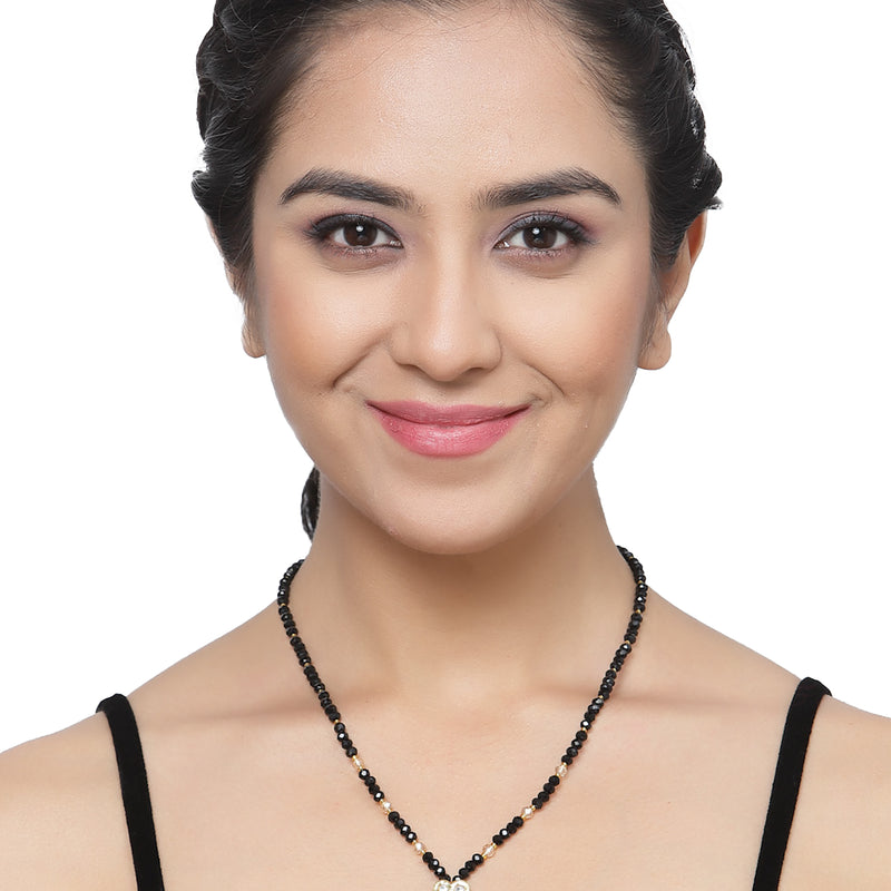 Gold-Plated Black & White Artificial Stones Studded & Beads Beaded Heart Shaped Locket Mangalsutra