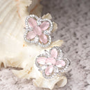 Rhodium-Plated Pink American Diamond studded Floral Shaped Stud Earrings