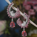 Rhodium-Plated Red American Diamond studded Peacock & Feather Shaped Drop Earrings