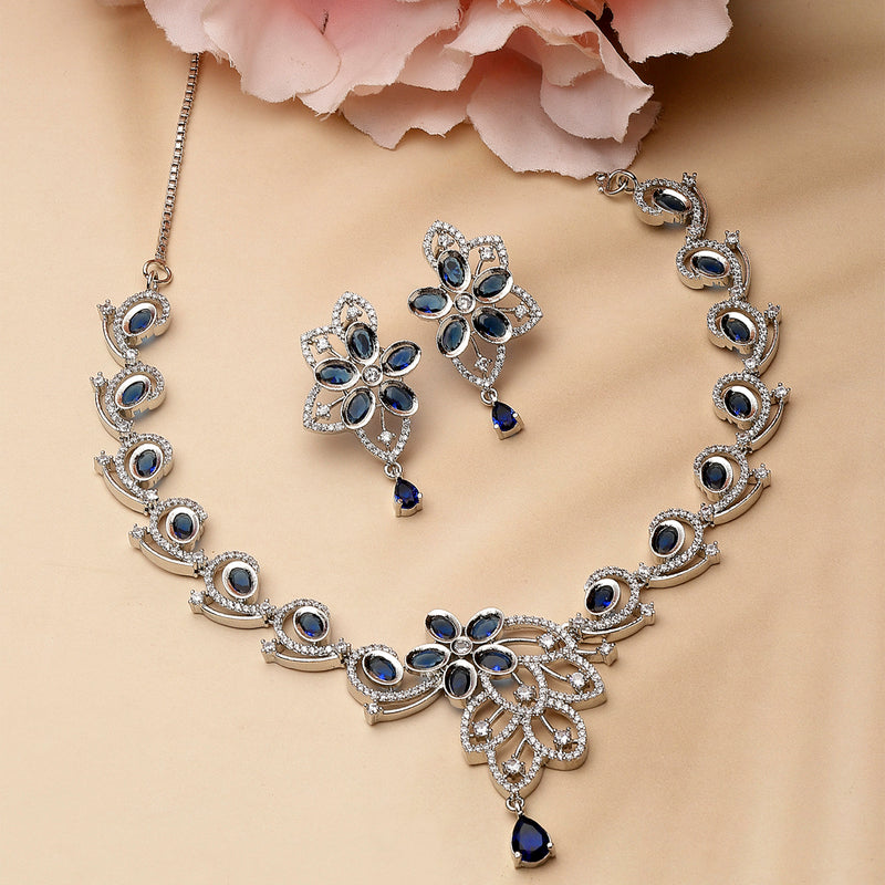 Rhodium-Plated Navy Blue American Diamond Studded Floral & Paisley Shaped Necklace with Earrings Jewellery Set