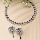 Rhodium-Plated Navy Blue American Diamond Studded Leaf Shaped Necklace with Earrings Jewellery Set