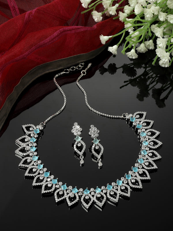 Rhodium-Plated Sky Blue American Diamond Studded Floral & Leaf Shaped Necklace with Earrings Jewellery Set