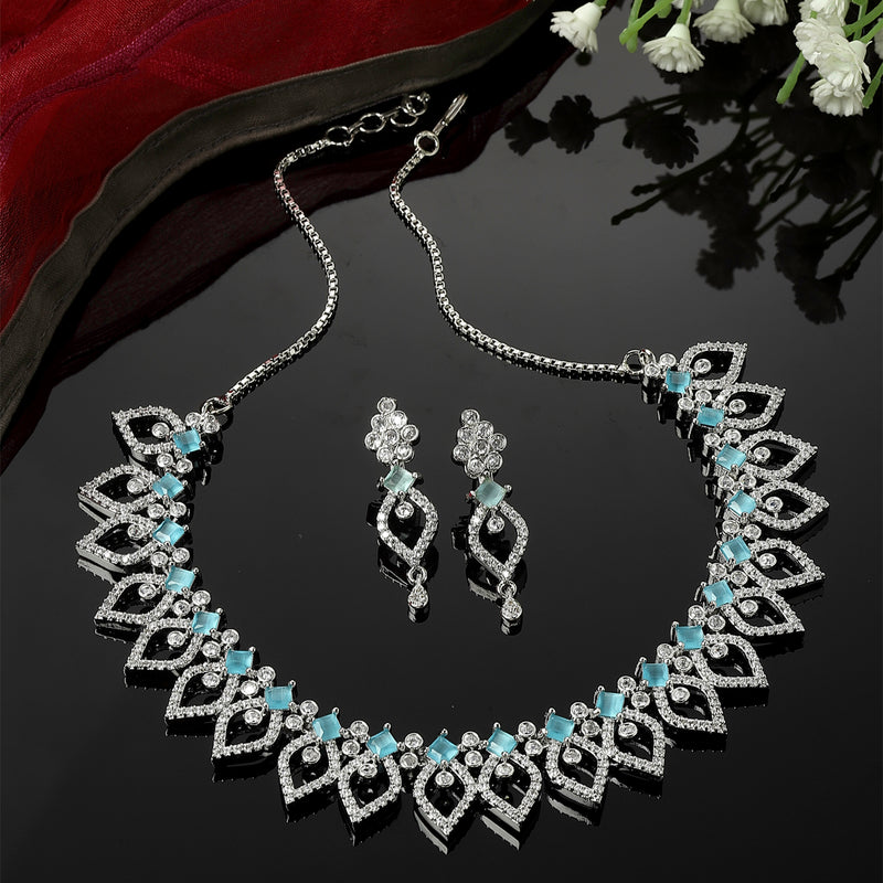 Rhodium-Plated Sky Blue American Diamond Studded Floral & Leaf Shaped Necklace with Earrings Jewellery Set