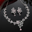Rhodium-Plated Pink American Diamond Studded Floral & Paisley Shaped Necklace with Earrings Jewellery Set