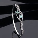 Rhodium Plated Silver Toned Floral Sea Green American Diamond Studded Kada Bracelet