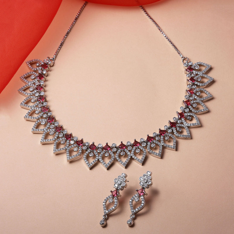 Rhodium-Plated Red American Diamond Studded Floral & Leaf Shaped Necklace with Earrings Jewellery Set
