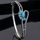 Rhodium Plated Silver Toned Flower Shaped Sky Blue American Diamond Studded Bracelet
