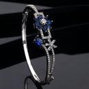 Rhodium-Plated Navy Blue Flower & Square Shape American Diamond Studded Kada Bracelet
