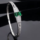 Rhodium Plated Silver Toned Square Shaped Emerald Green American Diamond Studded Bracelet