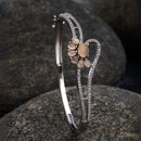 Rhodium Plated Silver Toned Flower Shaped Pink American Diamond Studded  Bracelet