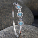 Rhodium-Plated Silver Toned Oval Shaped Blue American Diamond Studded Kada Bracelet