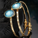 Gold-Plated Round Shaped Blue Cubic Zirconia Stone Studded Bangle Bracelet
