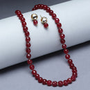 Gold-Plated Maroon Kundan Studded Pearl Shaped Necklace with Earrings Jewellery Set