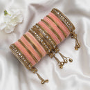Gold-Plated Peach Matte Finish Velvet AD Studded Gold Pearl Tasselled Bangles Set Of 56