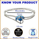 Rhodium Plated Silver Toned Flower Shaped Royal Blue American Diamond Studded  Bracelet